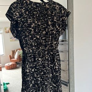 Black and tan short sleeve and shorter dress with cinched waist